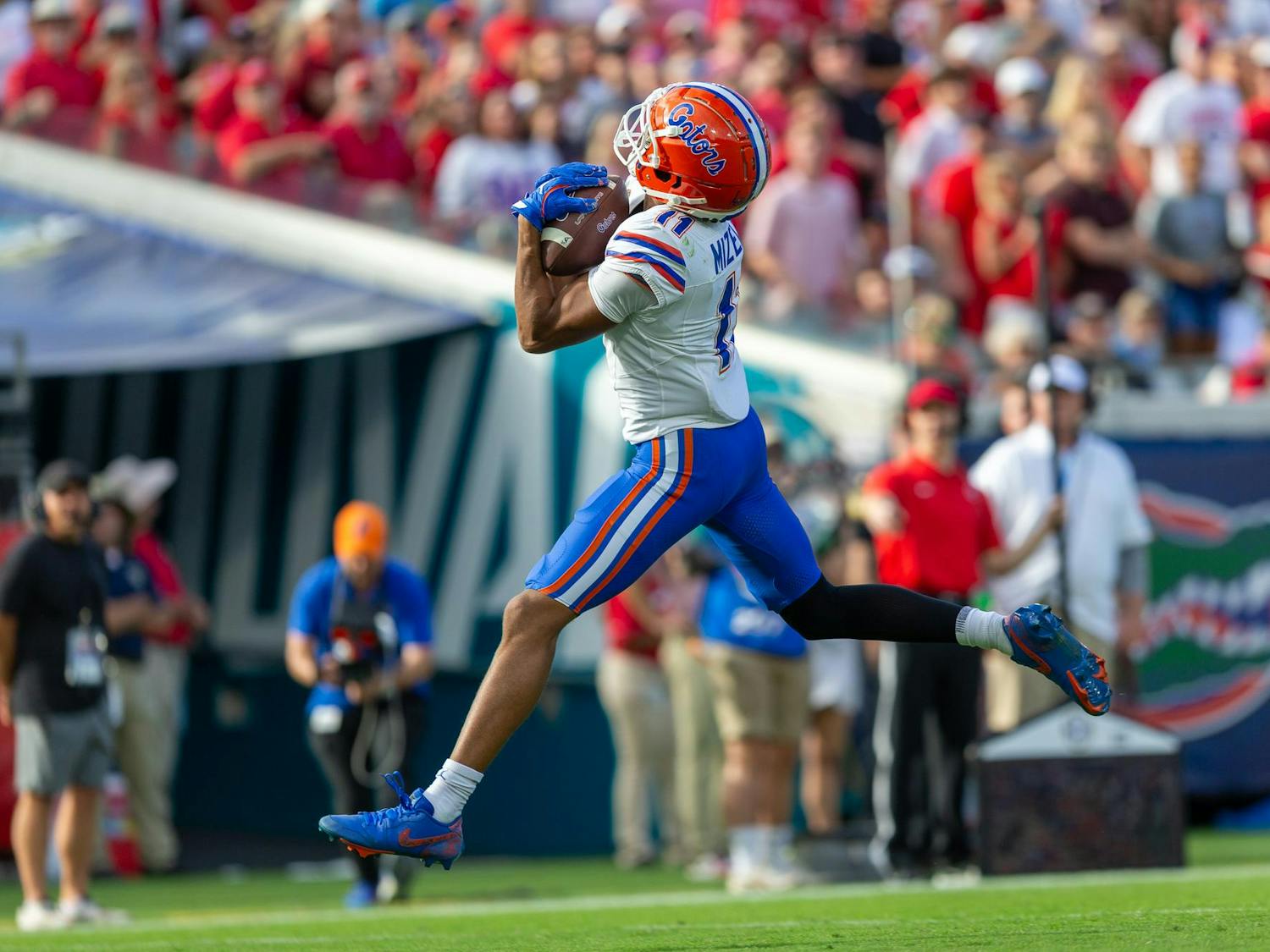 Florida Gators wide receiver Aidan Mizell (11) catches a touchdown pass from Florida Gators quarterback DJ Lagway (2) during the first half at TIAA Bank Field on Saturday, November 02, 2024.