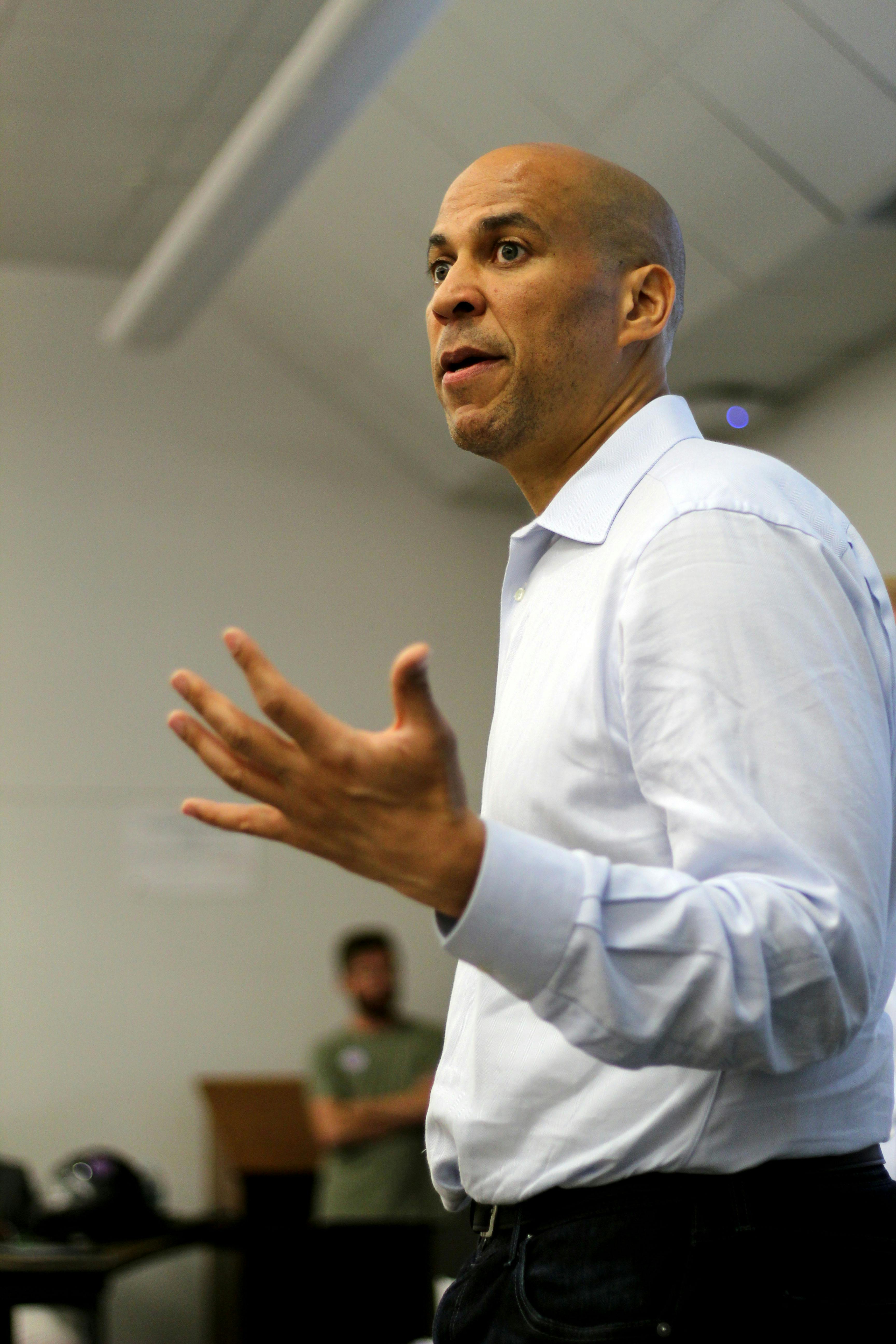 New Jersey Senator Cory Booker joins Senator Bill Nelson at a UF College Democrats meeting on Oct. 19 at Weil Hall. Students asked them questions about policies and their thoughts on current issues in the Senate.