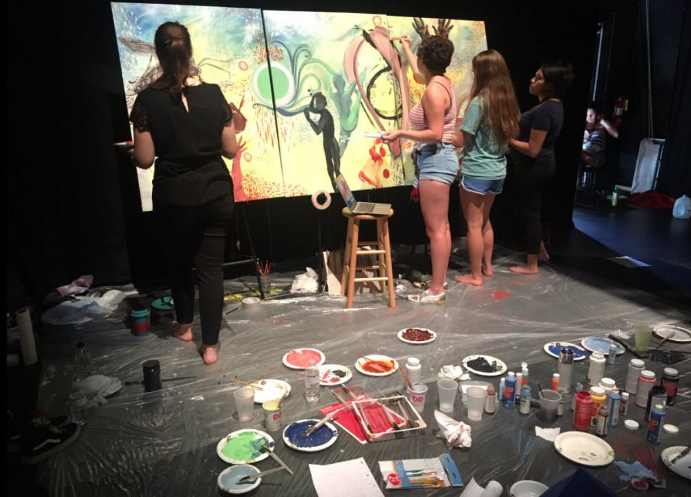 <p><span id="docs-internal-guid-43ada3c2-3257-b621-ed97-3aae7e50f5ca"><span>At the conference, four UF students from different art departments created a painting inspired by the talks. "It's relaxing," said Maddy Nave, a UF art junior with a specialization in print. "You just have to say yes to what everyone else is doing."</span></span></p>