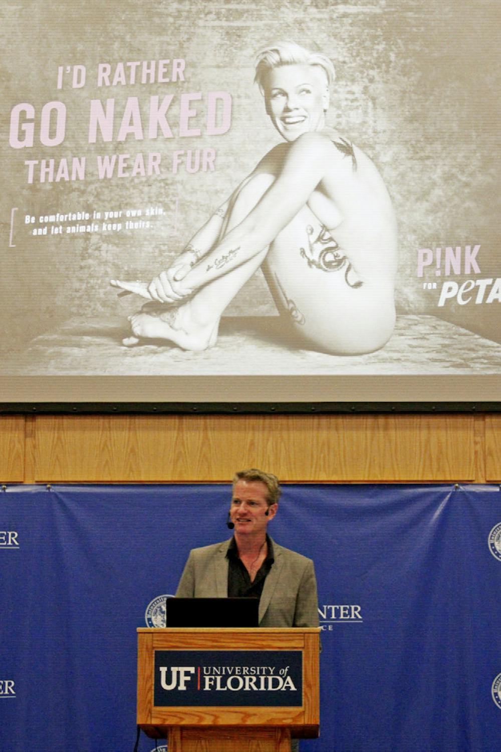 <p>Dan Mathews, senior vice president for PETA, speaks to an audience in Pugh Hall on Monday night about marketing strategies used by the organization.</p>