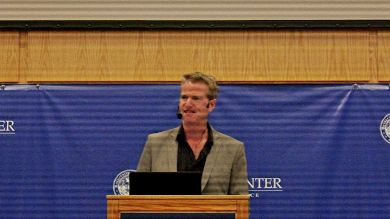 Dan Mathews, senior vice president for PETA, speaks to an audience in Pugh Hall on Monday night about marketing strategies used by the organization.