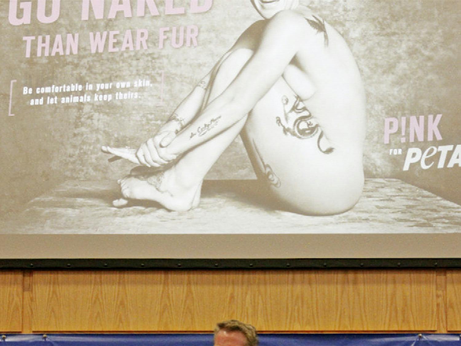 Dan Mathews, senior vice president for PETA, speaks to an audience in Pugh Hall on Monday night about marketing strategies used by the organization.