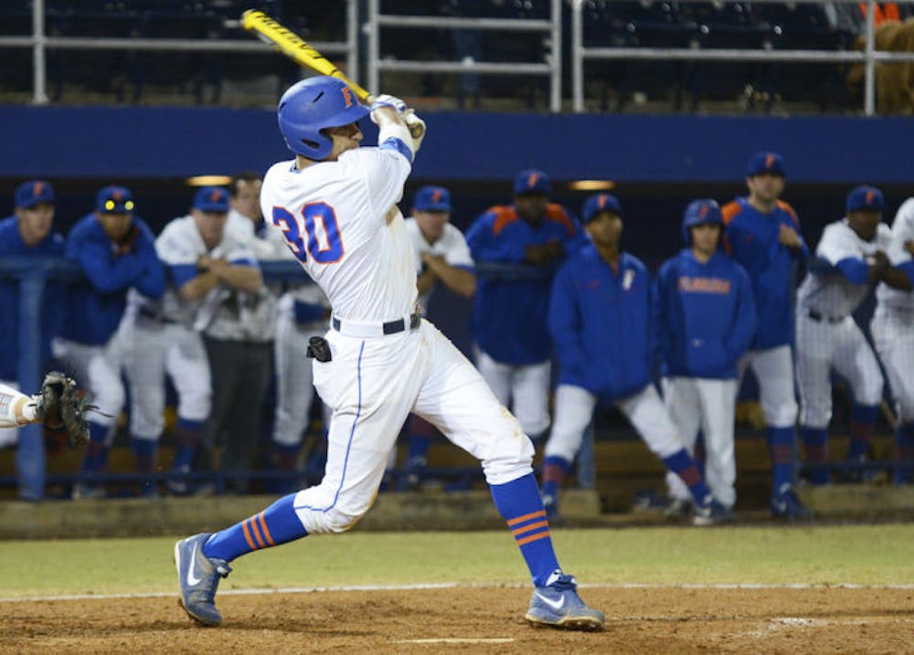 <p>Senior Vickash Ramjit swings at a pitch against Florida State on March 12,at McKethan Stadium. UF will play in the Southeastern Conference Tournament today against TAMU.</p>