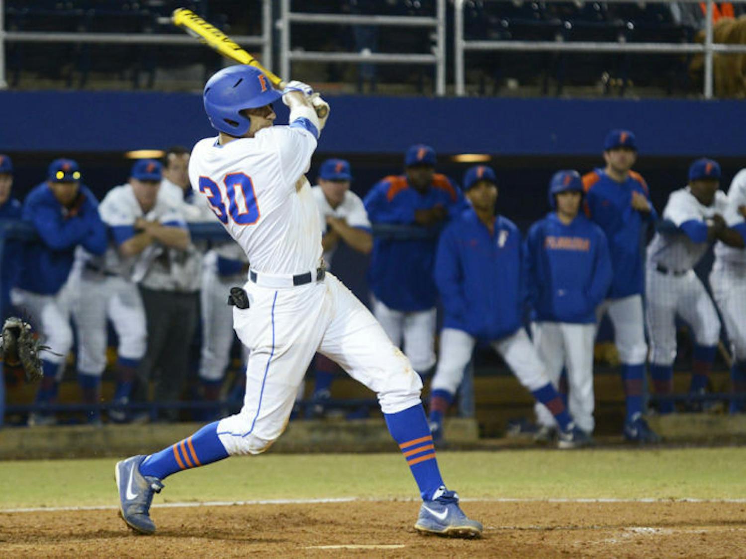 Senior Vickash Ramjit swings at a pitch against Florida State on March 12,at McKethan Stadium. UF will play in the Southeastern Conference Tournament today against TAMU.