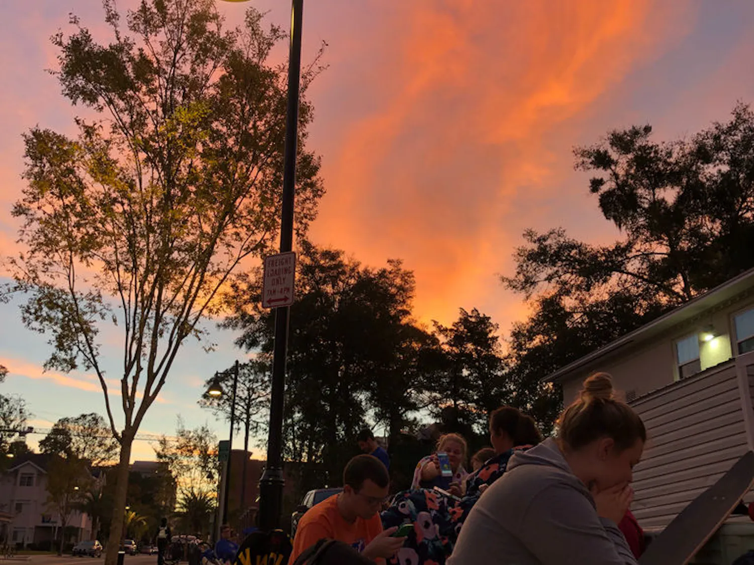 UF Alumni Association student members wait in line behind Emerson Alumni Hall to pick up their “Beat Missouri” long-sleeve shirt Thursday morning.