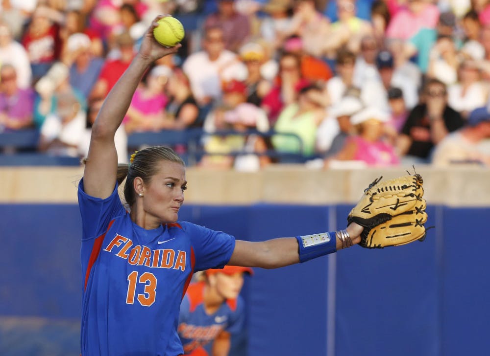 <p>Hannah Rogers delivers a pitch in the third inning of Florida's 5-0 win against Alabama in Game 1 of the Women's College World Series Championship Series in Oklahoma City on Monday</p>