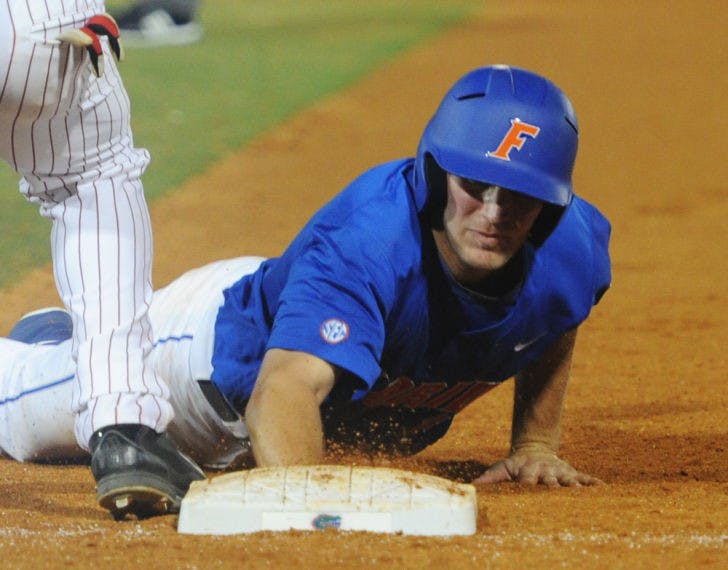 Braden Mattson dives toward first base during Florida’s 1-0 win against Arkansas on March 15 at McKethan Stadium. Mattson recorded one RBI and one run during UF’s 4-2 loss to Kentucky on Wednesday.