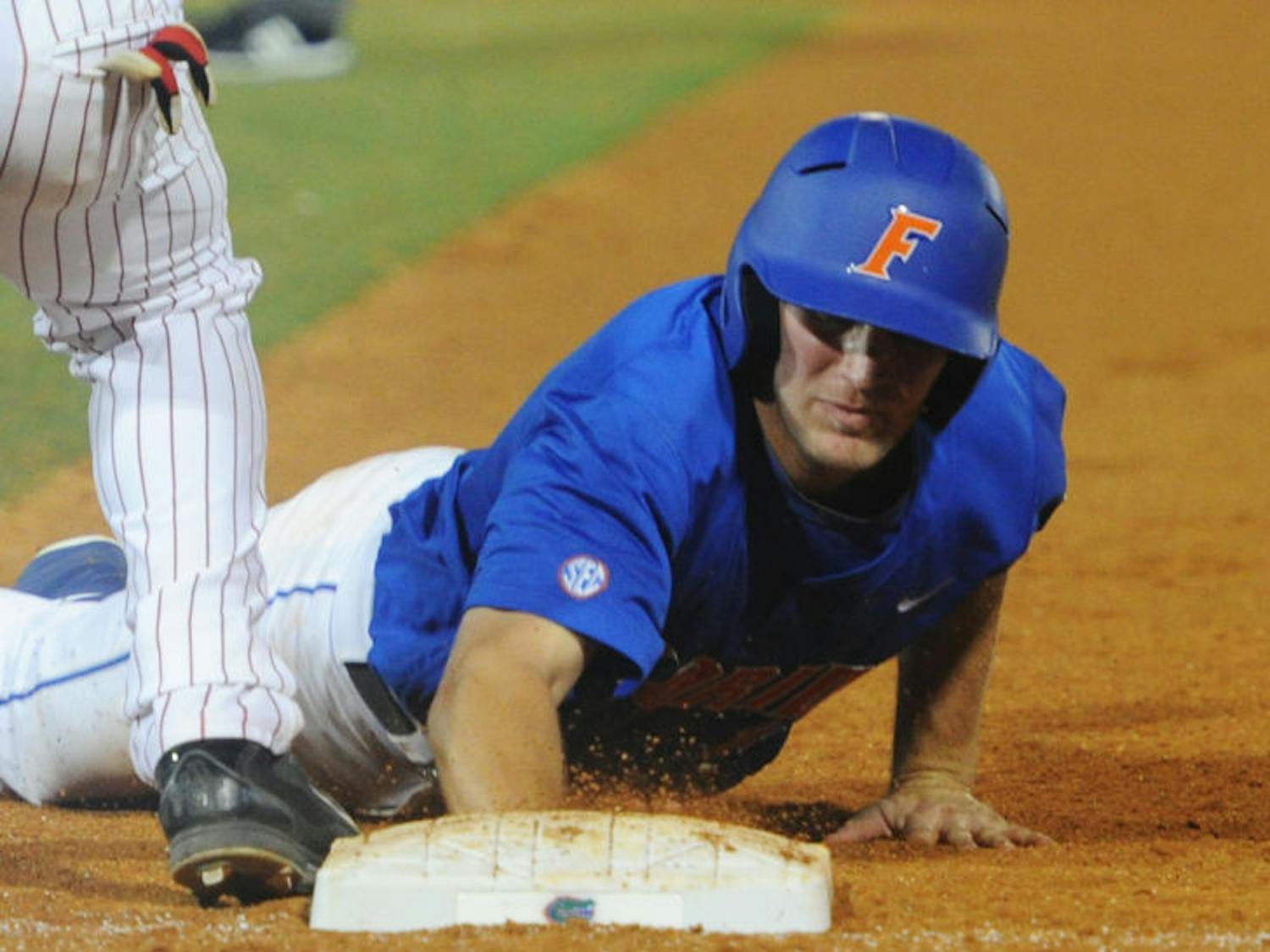 Braden Mattson dives toward first base during Florida’s 1-0 win against Arkansas on March 15 at McKethan Stadium. Mattson recorded one RBI and one run during UF’s 4-2 loss to Kentucky on Wednesday.