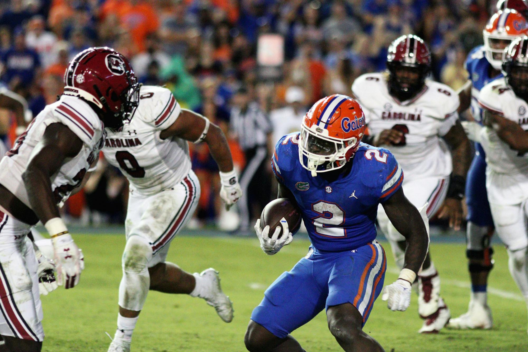 Florida running back Montrell Johnson Jr. evades South Carolina defenders during the Gators&#x27; win Saturday, Nov. 12, 2022. ﻿