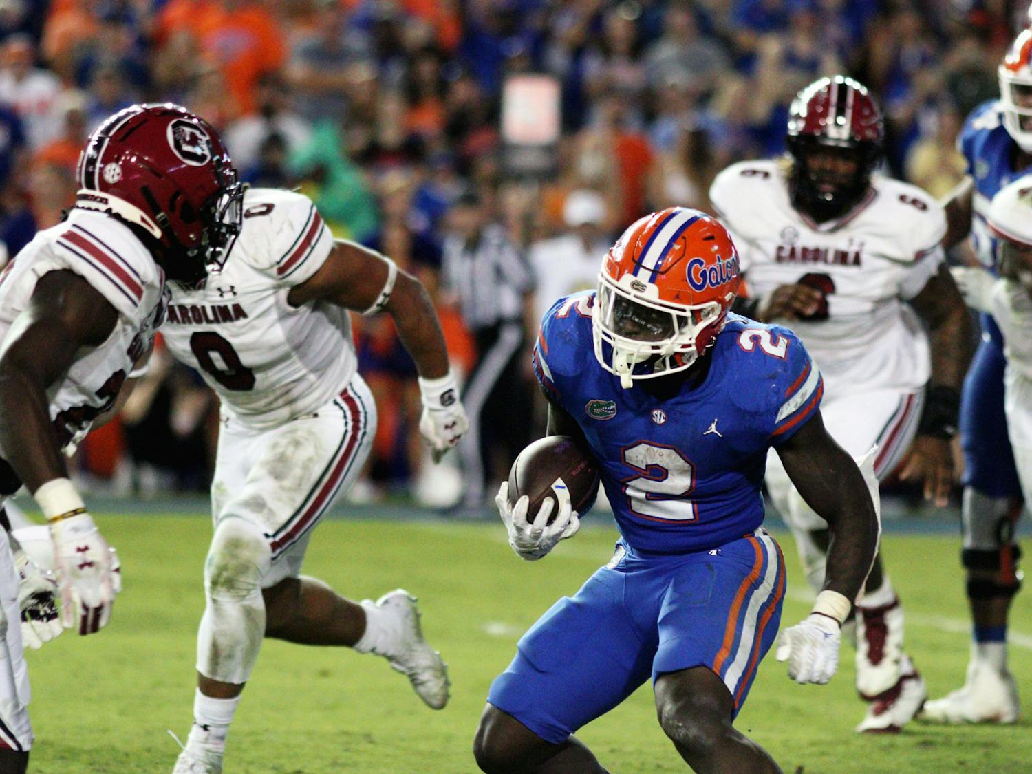 Florida running back Montrell Johnson Jr. evades South Carolina defenders during the Gators' win Saturday, Nov. 12, 2022. 