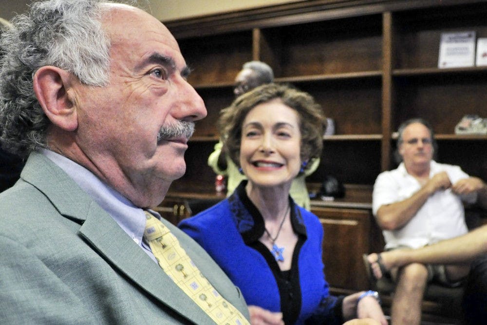 Harvey Budd and his wife Ilene Silverman react to the city commission election results at the Supervisor of Elections office on Tuesday. Budd, who received 33.31 percent of the vote, will run off for the at-large seat against Jay Curtis, who received 32.31 percent of the vote.