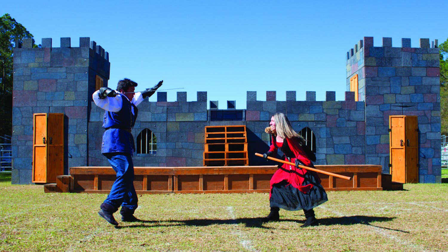 Chris Rodd-Layedra, 24, and Sara Greenberg, 22, practice a fighting routine at the Alachua County Fairgrounds on Wednesday. Rodd-Layedra fights with a sword while Greenberg fights with a staff and a stuffed squirrel, which sits on her shoulders.