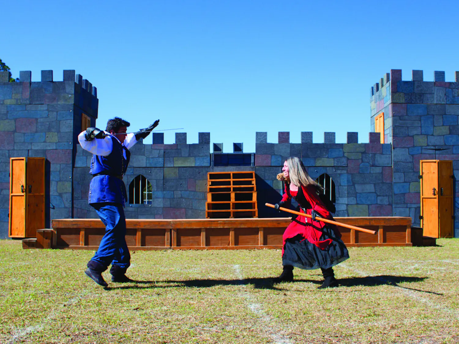 Chris Rodd-Layedra, 24, and Sara Greenberg, 22, practice a fighting routine at the Alachua County Fairgrounds on Wednesday. Rodd-Layedra fights with a sword while Greenberg fights with a staff and a stuffed squirrel, which sits on her shoulders.