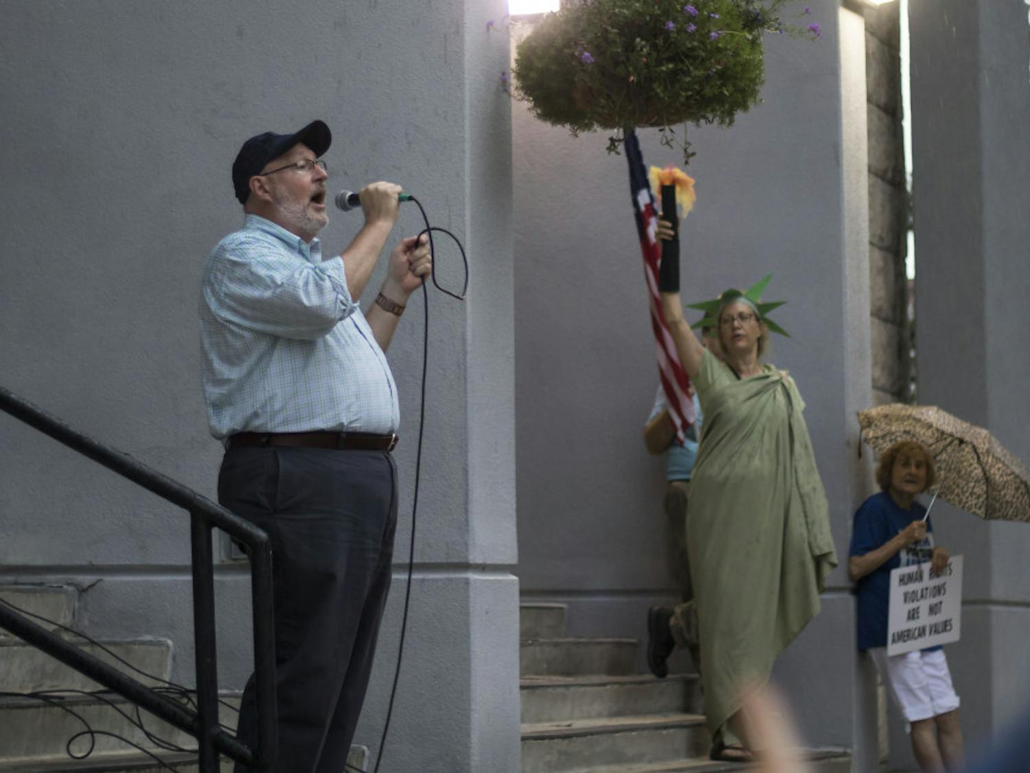 At a recent Gainesville protest, City Commissioner Harvey Ward asked the crowd to support the city joining the lawsuit. 