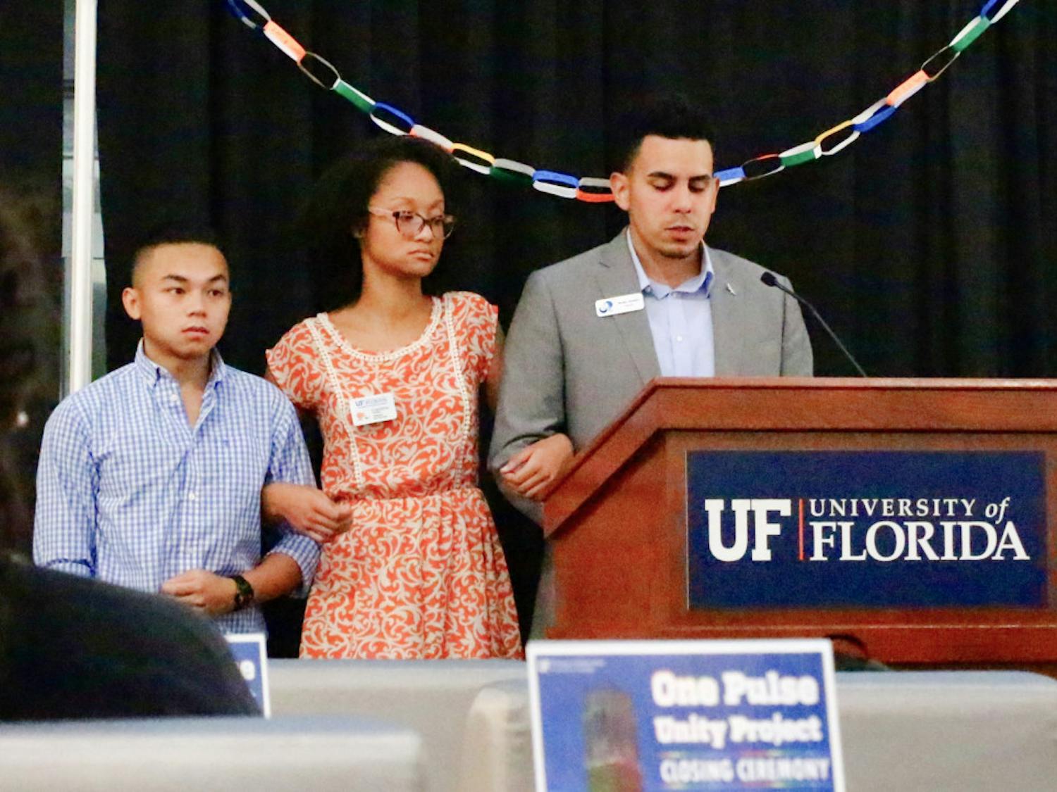 UF’s Multicultural &amp; Diversity Affairs executive director Lloren Foster speaks on Thursday morning at the closing ceremony for the One Pulse Unity Project, asking the crowd for a moment of silence to honor the victims of the Pulse shooting. Foster concluded everyone present was, "here to show solidarity not only for victims, families and communities… but for each other."