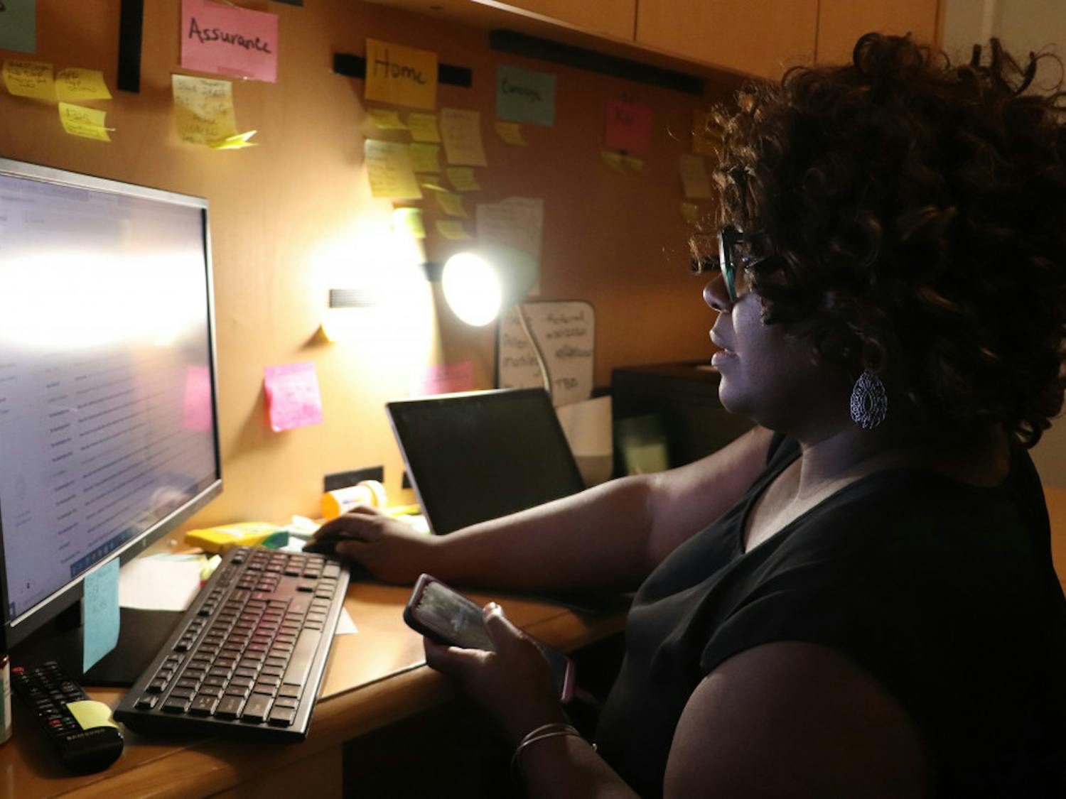 Chanae Jackson checks her email while talking on the phone in Ocala, Fla., on Thursday, Sept. 24, 2020. She said she spends about seven hours a day on the phone talking with clients, paying bills, following-up for her community work and client services, marketing her businesses and making personal phone calls.