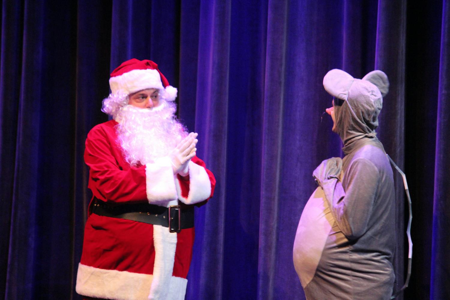 Matthew Lindsay and Connor Nugent perform as Santa Claus and Perry the Mouse for the Holiday Santa Fe show on Saturday, Dec. 2, 2023.