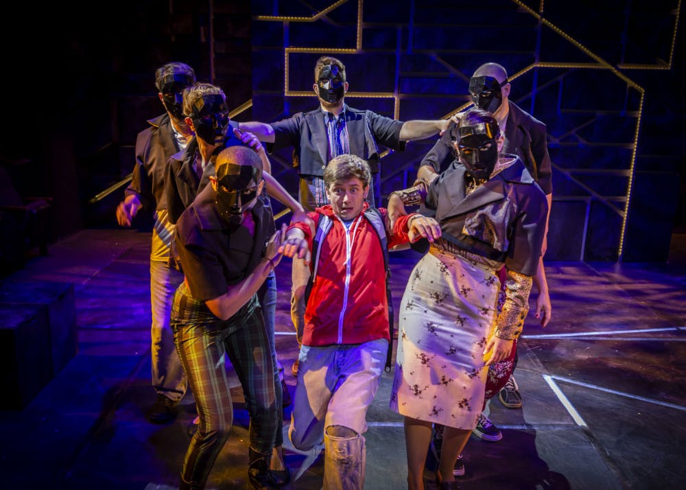 Actor Kyle Brumley (center) portrays&nbsp;15-year-old Christopher in "The Curious Incident of the Dog in the Night-Time".&nbsp;This scene gives the audience a visual representation of the jarring experience Christopher has when interacting with the outside world.