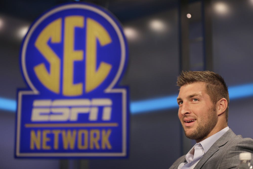 <p>Tim Tebow answers a question during a interview on the set of ESPN's new SEC Network in Charlotte, N.C. on Aug. 6.</p>