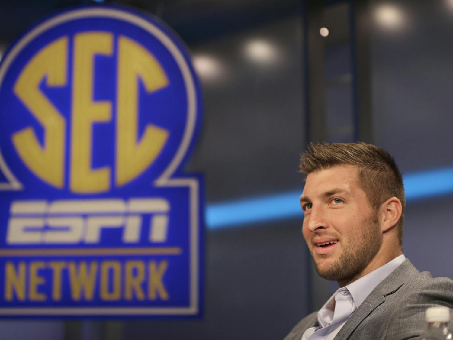 Tim Tebow answers a question during a interview on the set of ESPN's new SEC Network in Charlotte, N.C. on Aug. 6.