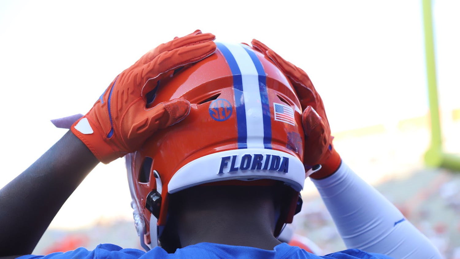 A Florida player touches his helmet during warmups before a game against Florida Atlantic on Sept. 4.