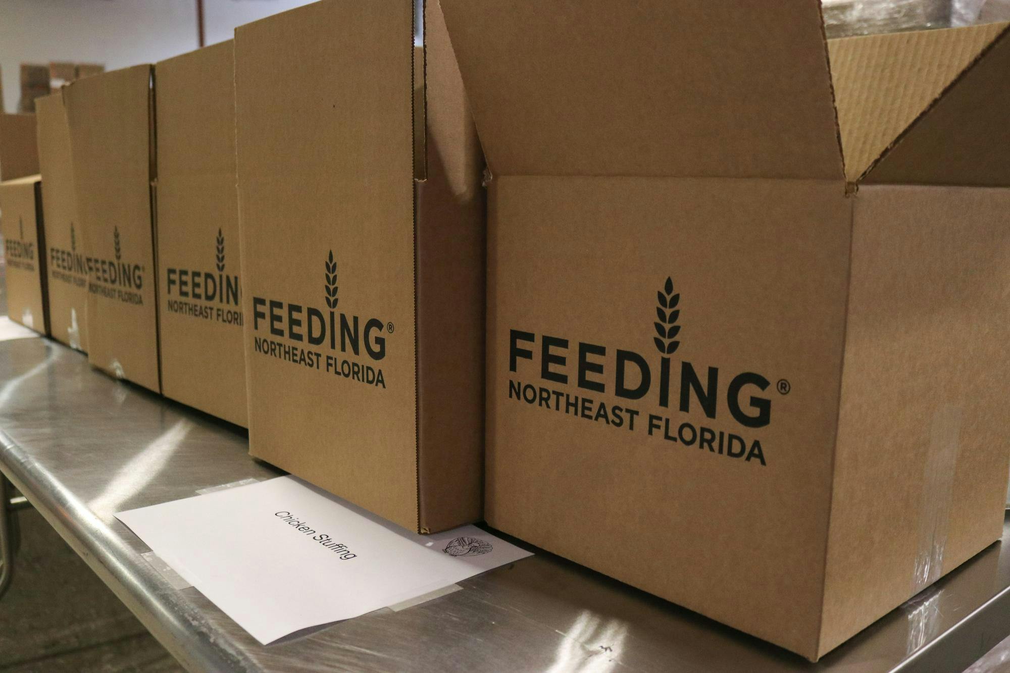 Boxes are lined up before being filled with nonperishable food items for Feeding Northeast Florida’s Thanksgiving food drive, which makes 1,375 packed boxes for families in the Gainesville community at the Bread of The Mighty Food Bank Friday, Nov. 7, 2025. 