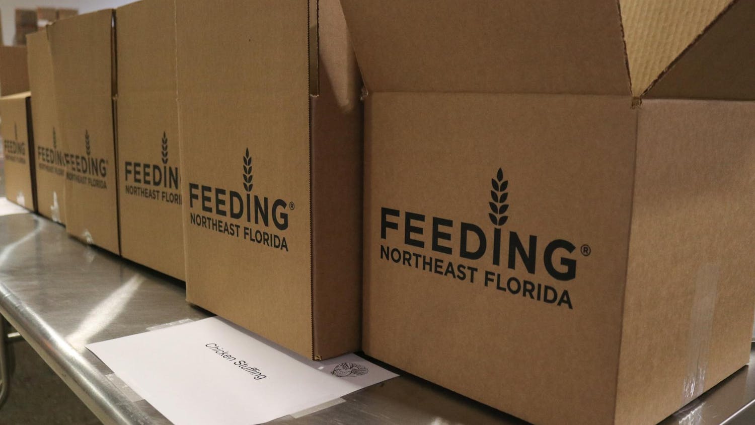 Boxes are lined up before being filled with nonperishable food items for Feeding Northeast Florida’s Thanksgiving food drive, which makes 1,375 packed boxes for families in the Gainesville community at the Bread of The Mighty Food Bank Friday, Nov. 7, 2025.