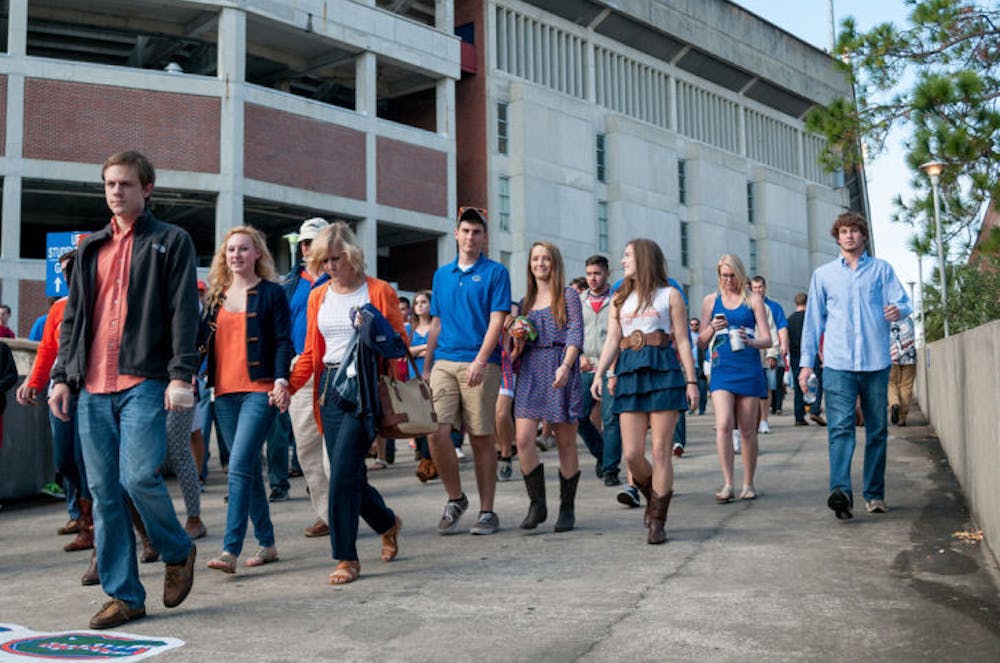 <p>Game attendees exit the stadium during the third quarter of Florida’s 37-7 loss to Florida State on Saturday. This is UF’s first losing season since 1979.</p>