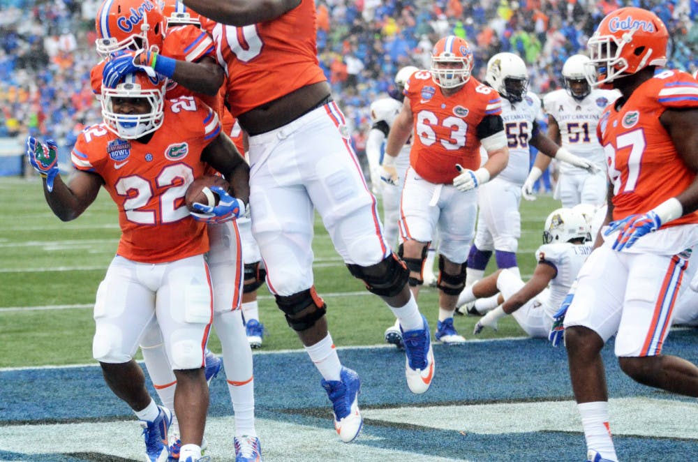 <p>Adam Lane rushes for a touchdown during Florida's 28-20 win in the Birmingham Bowl against East Carolina on Jan. 3 at Legion Field.</p>