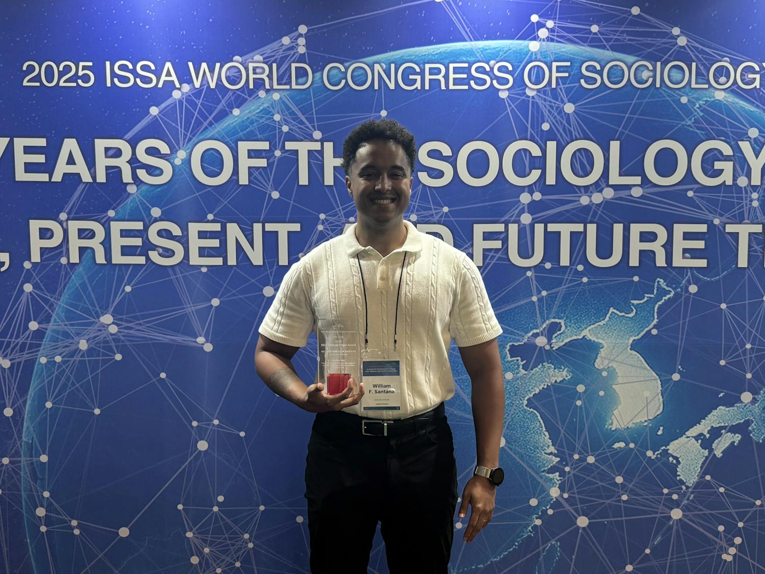 William Ferraz de Santana poses with the Graduate Paper Award at the International Sociology of Sport Association Conference in Seoul, South Korea on Wednesday, July 9, 2025.