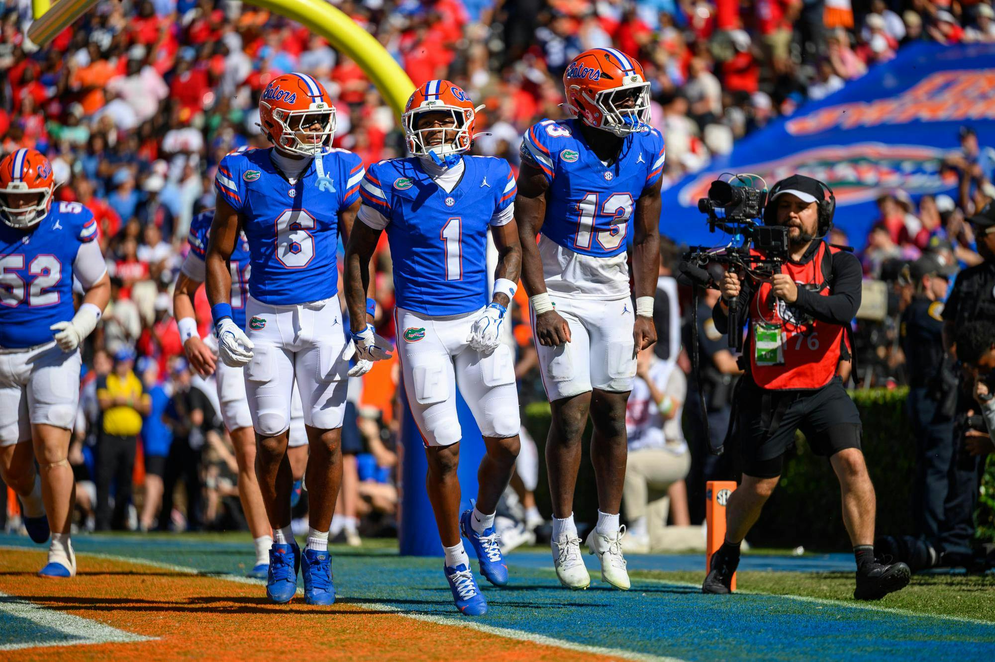 Florida wide receiver Dallas Wilson (6), wide receiver Vernell Brown III (1) and running back Jadan Baugh (13) celebrate during the first half of an NCAA college football game against Ole Miss, Saturday, Sept. 26, 2026, in Gainesville, Fla.