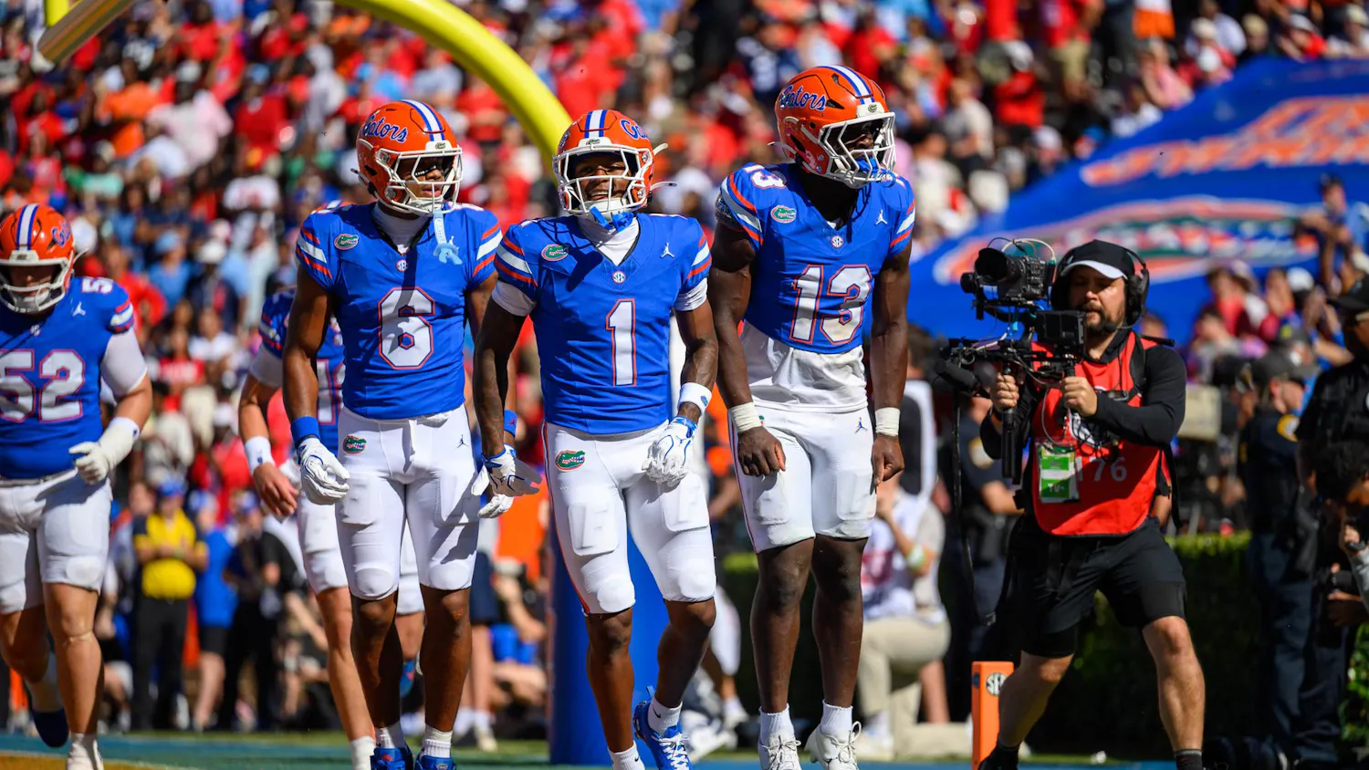 Florida wide receiver Dallas Wilson (6), wide receiver Vernell Brown III (1) and running back Jadan Baugh (13) celebrate during the first half of an NCAA college football game against Ole Miss, Saturday, Sept. 26, 2026, in Gainesville, Fla.
