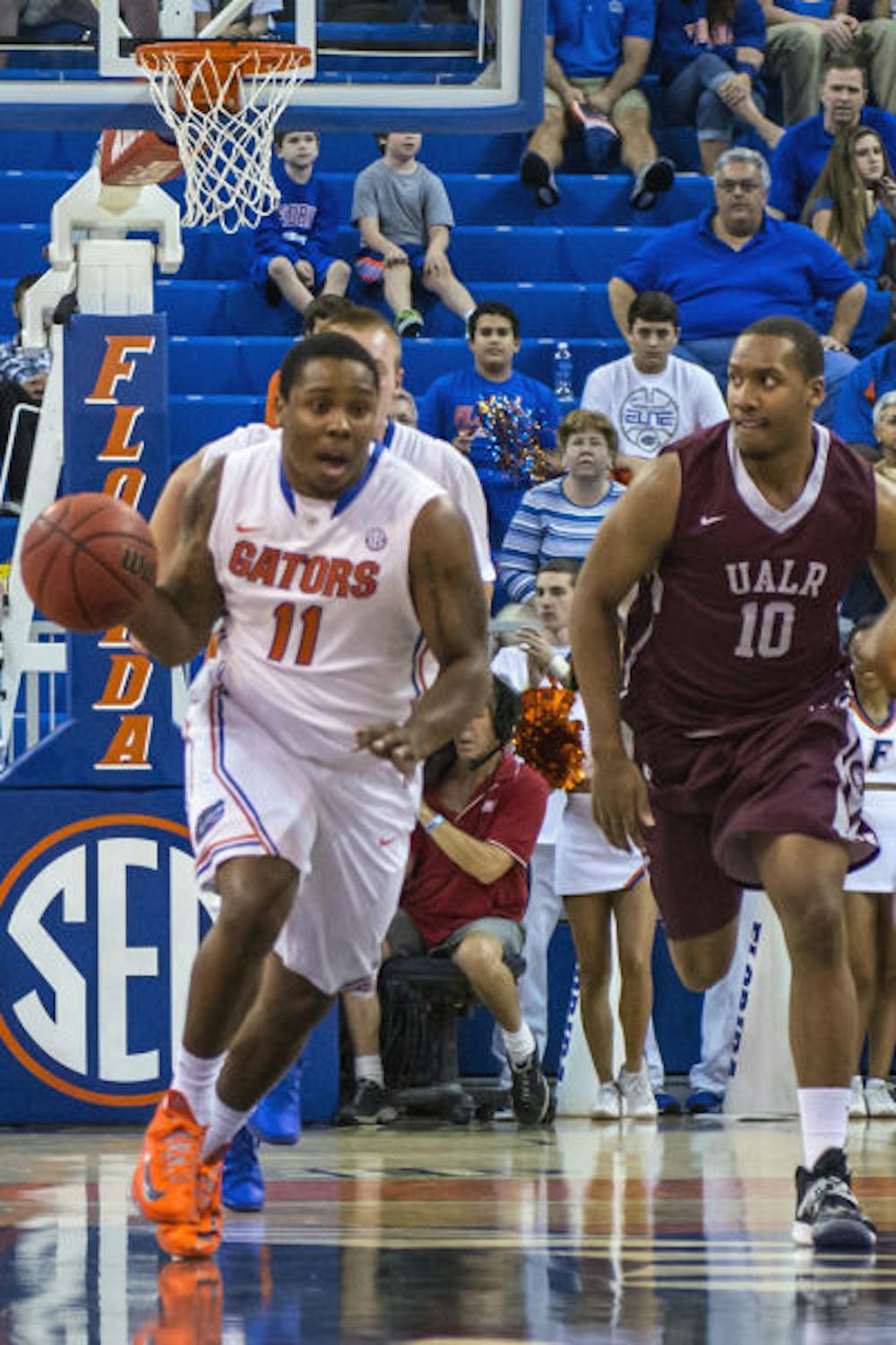 <p>Walk-on guard Lexx Edwards (11) dribbles down the court during No. 11 Florida's 86-56 win against Arkansas Little-Rock on Saturday in the O'Connell Center.</p>