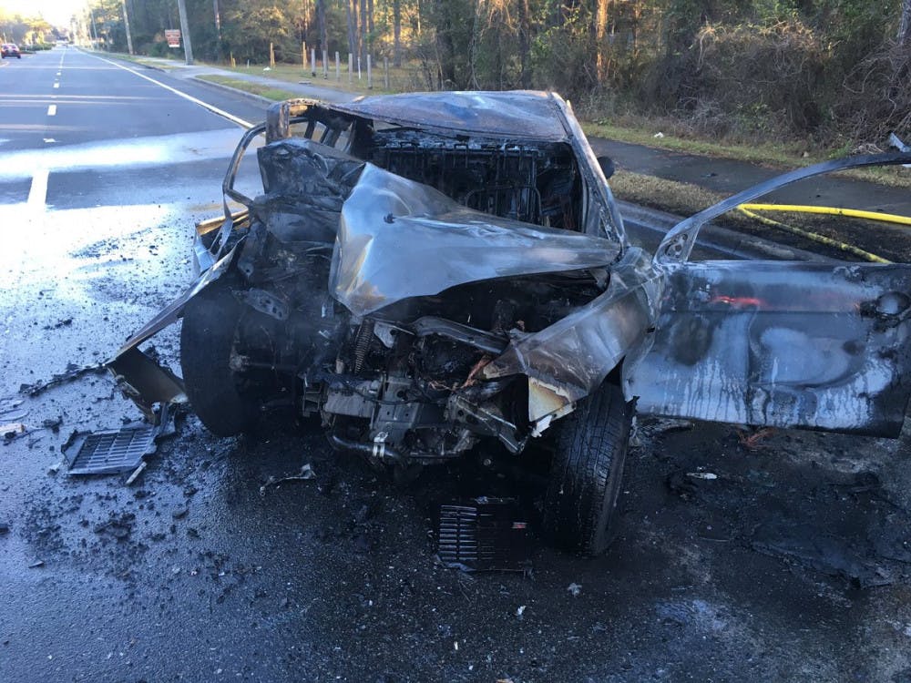 A car caught on fire after the driver crashed with a pole on Monday.