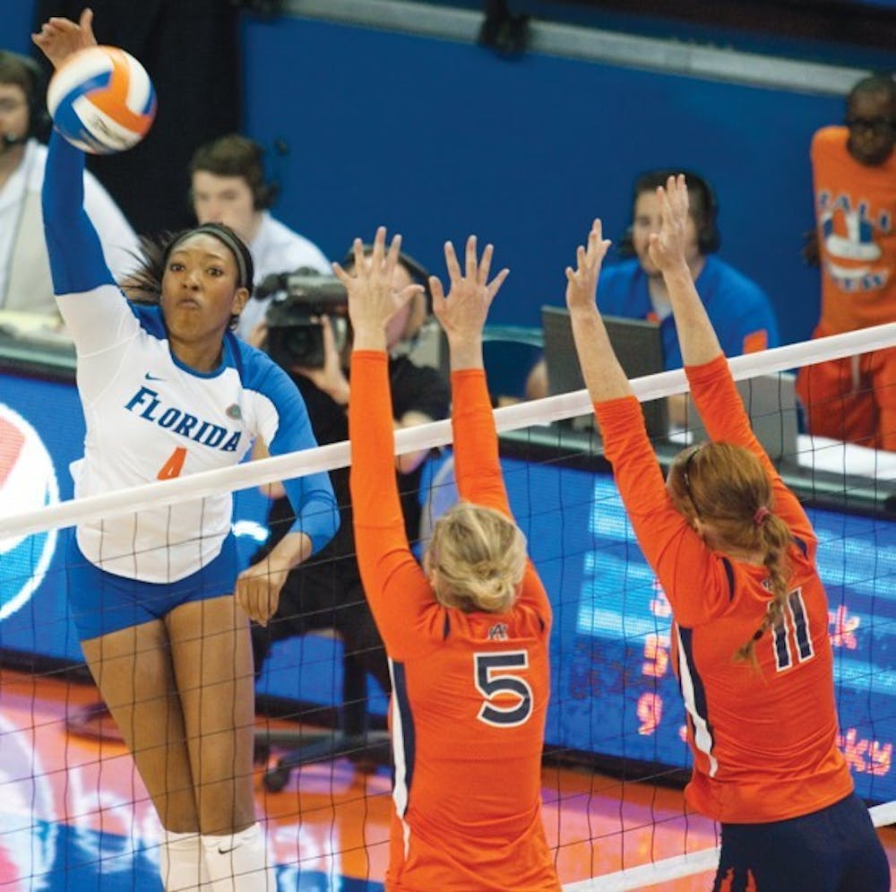 <p>Tangerine Wiggs spikes the ball over the Auburn Tigers on Nov. 20, 2011.</p>