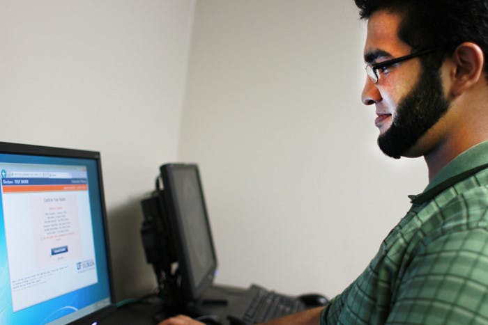 Umair Asghar, an 18-year-old mechanical engineering sophomore, tests the new electronic voting system. Senators chose candidates from the Star Wars Party and the Fantasy Party.