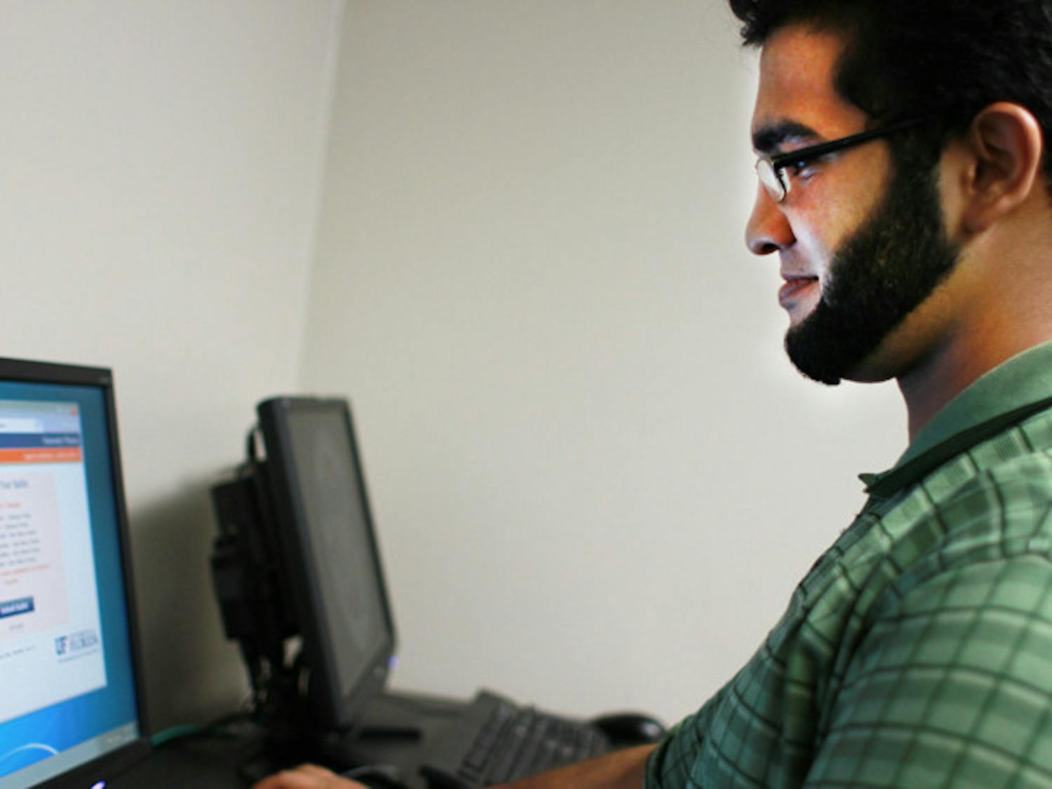 Umair Asghar, an 18-year-old mechanical engineering sophomore, tests the new electronic voting system. Senators chose candidates from the Star Wars Party and the Fantasy Party.