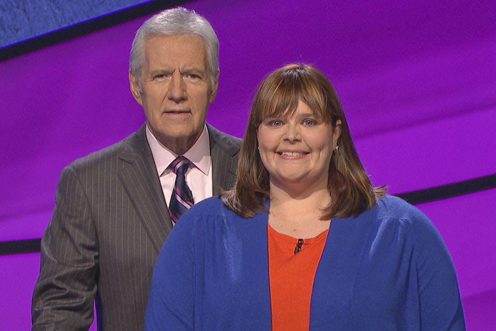 <p>UF alumna Kyle Lauren Webb, a graduate of the UF College of Veterinary Medicine, poses for a photo with “Jeopardy!” host Alex Trebek. Webb competed on “Jeopardy!” in December, taking first place and $4,399, but her episode aired Tuesday night.</p>