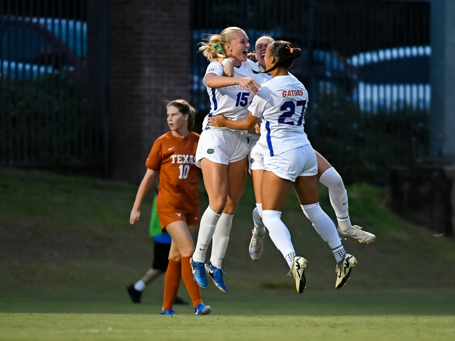 Florida Gators midfielder Lauren Donovan (15) celebrates her first career goal with Florida Gators midfielder Norah Abbott (27) and Florida Gators defender Josie Curtis (9) during the first half at Donald R. Dizney Stadium on Friday, October 04, 2024.