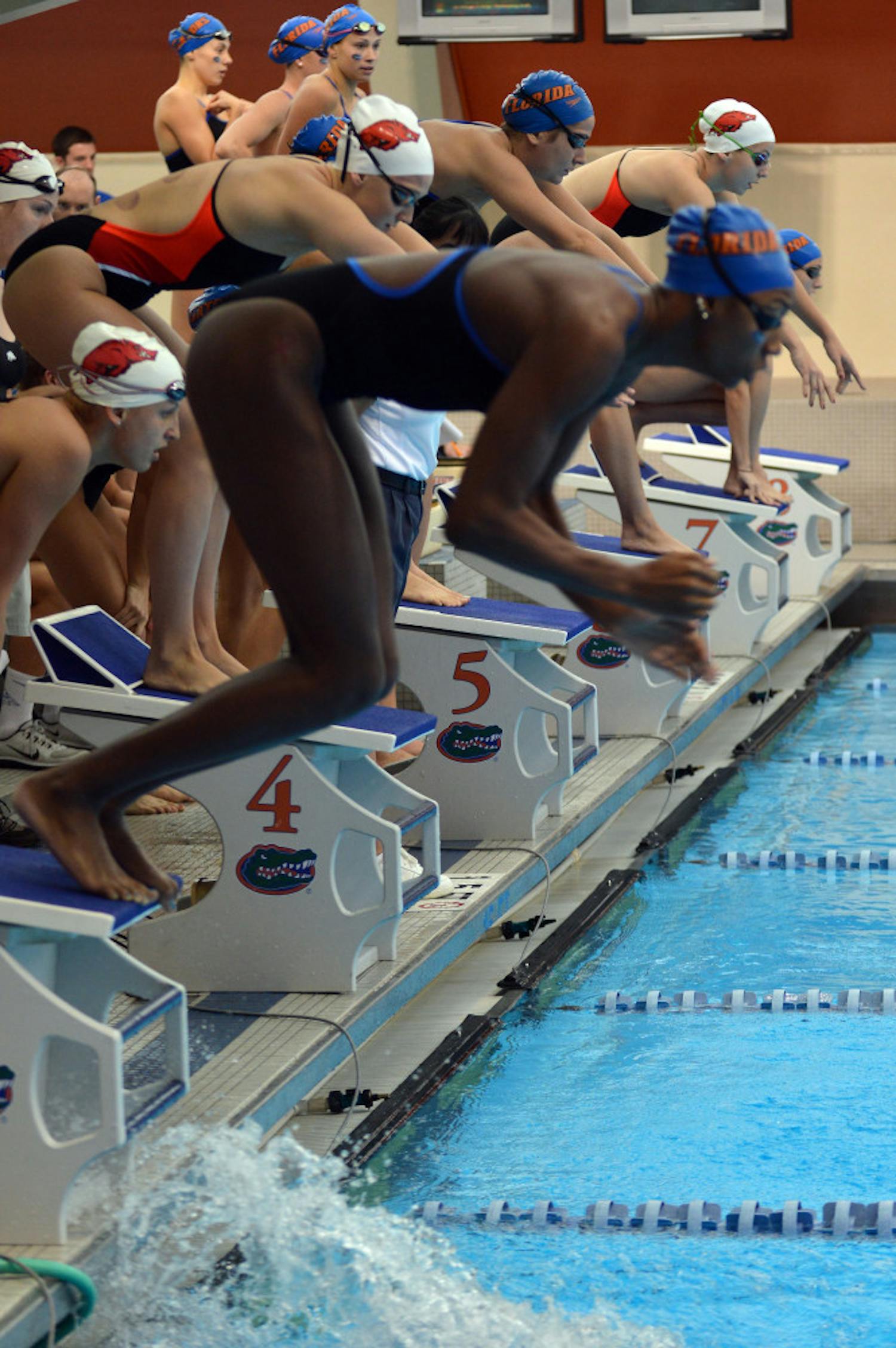 Nathalie Hinds jumps into the pool for her leg of the 200 IM relay during Florida's 189.5-110.5 win against Arkansas on Saturday in the O'Connell Center.