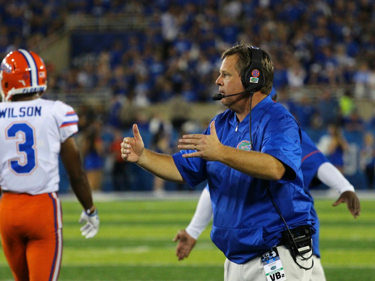 UF coach Jim McElwain motions to the Gators defense during Florida's 28-27 win against Kentucky on Saturday at Kroger Field.