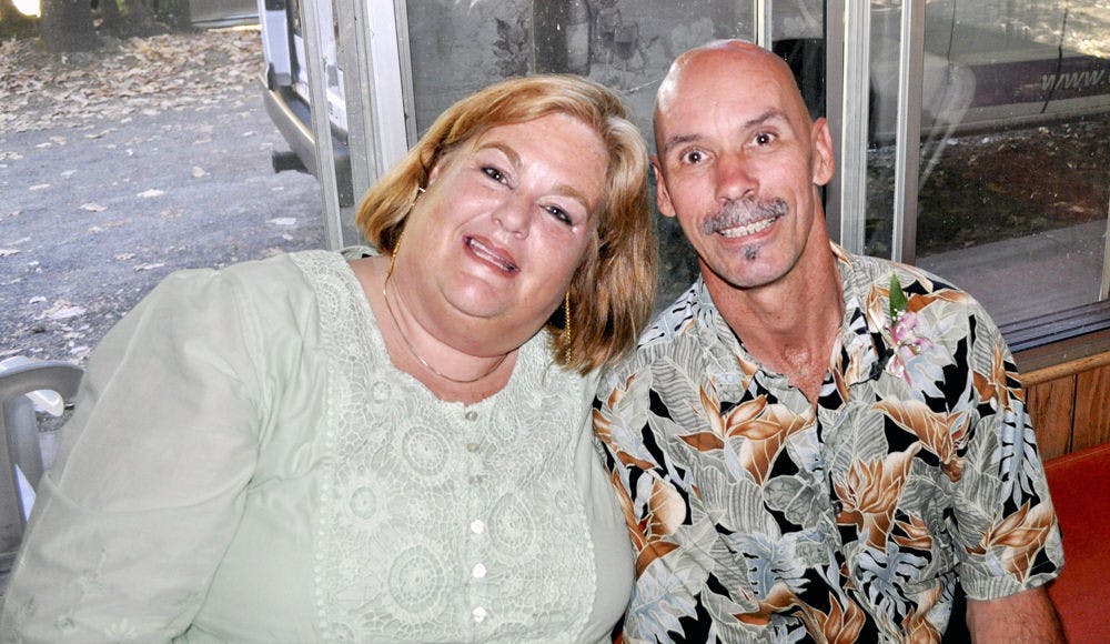 Gretchen Church (left), and Michael Church, both diagnosed with Parkinson’s disease at 32, pose for a photo. The Churches met through an online support group they started for people with Parkinson’s disease, which has grown into a non-profit called Movers and Shakers.