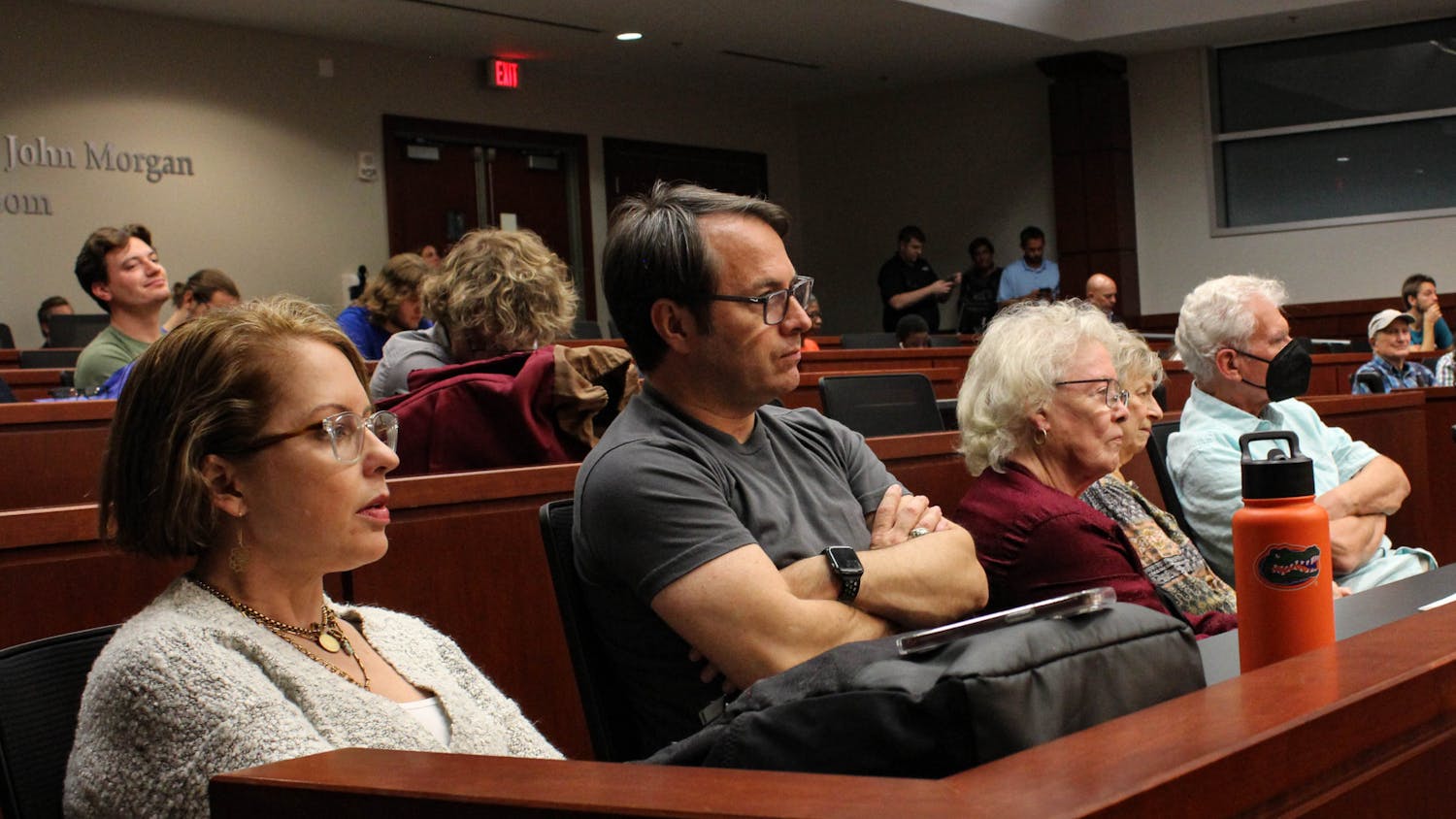 Attendees watch the mayoral debate between Harvey Ward and Ed Bielarski at UF Levin College of Law Tuesday, Oct. 25, 2022.