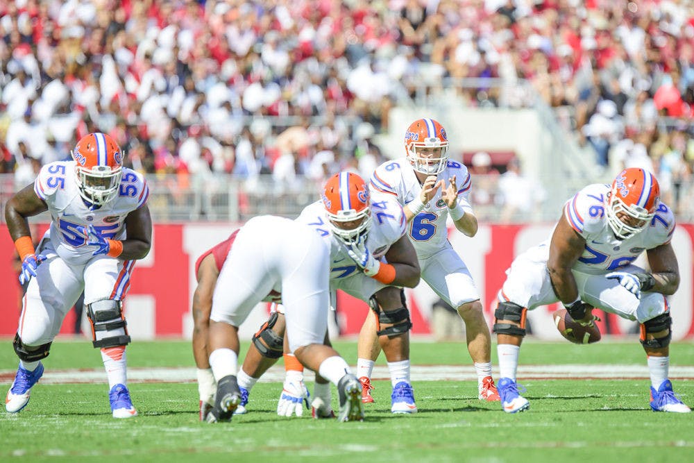 Max Garcia (76) snaps the ball to Jeff Driskel during Florida's 42-21 loss to Alabama on Sept. 20 at Bryant-Denny Stadium.