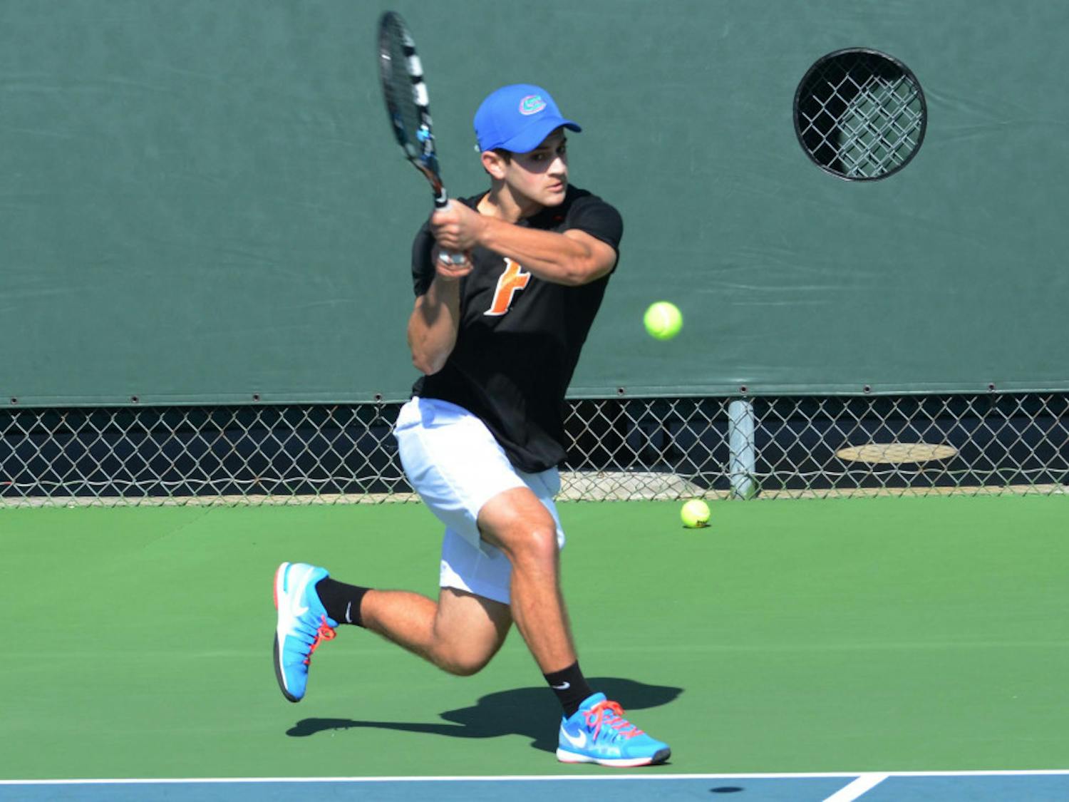 Elliott Orkin returns a ball during Florida's 9-3 win against William &amp; Mary on Saturday at the Ring Tennis Complex.