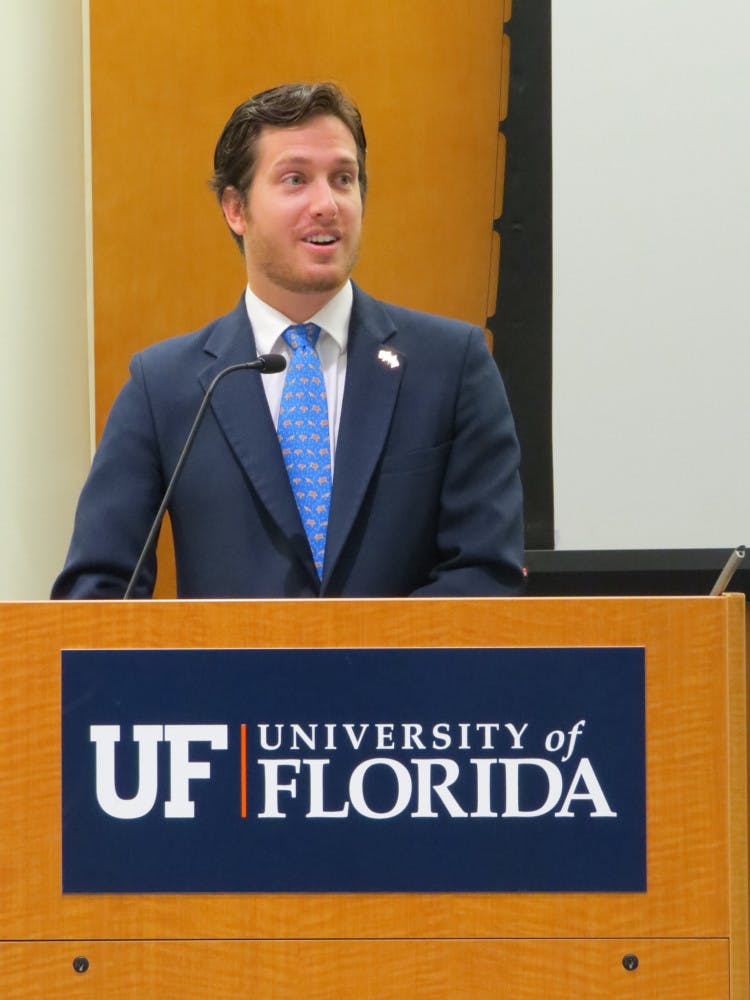 Minority Leader Ford Dwyer delivers a final speech to Student Senate in the Reitz Union on Tuesday evening. Dwyer is resigning his seat as senator to focus on his law-school studies next semester.