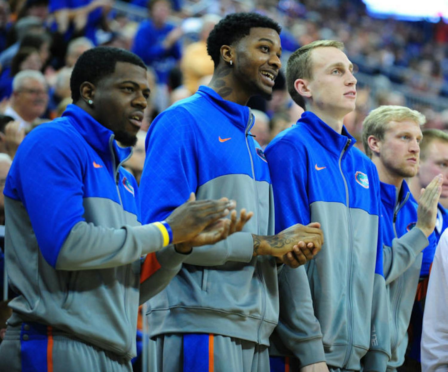 Chris Walker (middle) watches from the bench during Florida’s 74-58 win against South Carolina on Jan. 8 in the O’Connell Center. Walker is expected to make his college debut against Missouri tonight at 9 p.m.