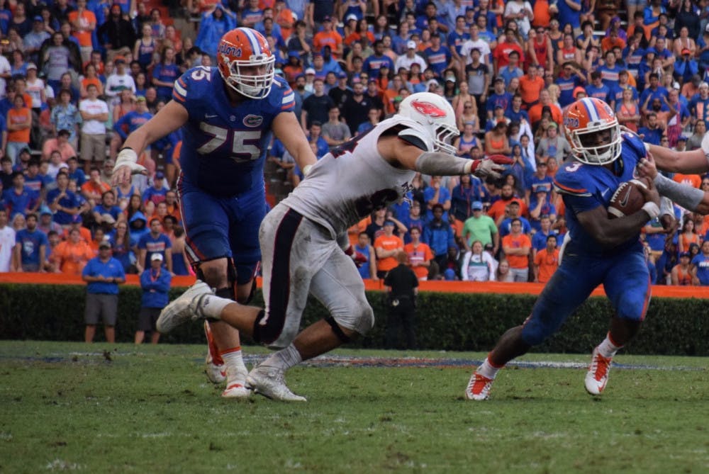 UF offensive lineman Mason Halter goes in for a block during Florida's 20-14 overtime win against Florida Atlantic on Nov. 21, 2015, at Ben Hill Griffin Stadium.