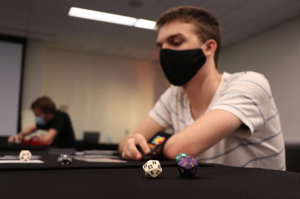 Ryan Feldbush, 19, a UF computer science sophomore, is seen playing ‘Magic: The Gathering’ at the Reitz Student Union on Wednesday, Sept. 30, 2020. Feldbush said he’s played the game for six years now.&nbsp;