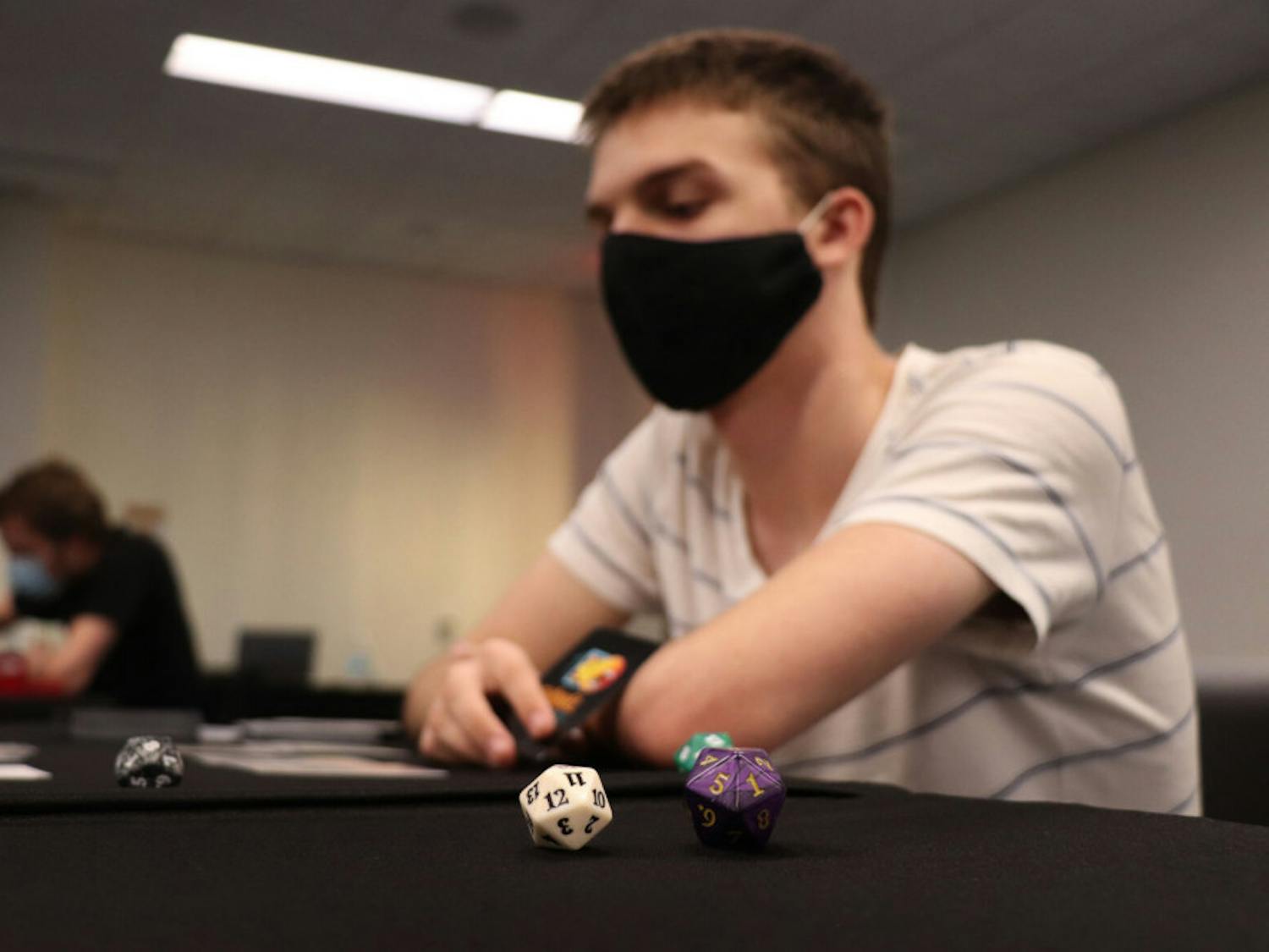 Ryan Feldbush, 19, a UF computer science sophomore, is seen playing ‘Magic: The Gathering’ at the Reitz Student Union on Wednesday, Sept. 30, 2020. Feldbush said he’s played the game for six years now.&nbsp;